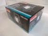 A product box for a Makita LED work light sits on a white surface. Podgląd zdjęcia produktu
