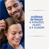 A couple is shown in a close-up shot, with the woman's head resting on the man's shoulder. They are both smiling. Podgląd zdjęcia produktu