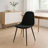 A black chair is placed in a dining room setting next to a wooden table and a sideboard. Anteprima dell’immagine prodotto