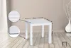 A white square side table is shown in a room with wooden flooring and a beige wall. Dimensions are indicated with arrows and numbers. Voir les images du produit