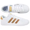 A top-down and side view of a pair of white Adidas sneakers with gold accents. Produktbild-Vorschau