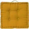 A square floor cushion with tufting and a handle on top. Náhled obrázku produktu
