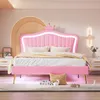 A pink upholstered bed with a crown-shaped headboard and LED lighting in a bedroom setting. Produktbild-Vorschau