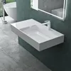 A modern bathroom with a wall-mounted sink and a bathtub visible in the background. Produktbild-Vorschau