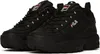 A pair of black Fila sneakers. Voir les images du produit