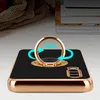 A smartphone case with a ring holder is shown on a table. Produktbild-Vorschau