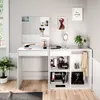 A white vanity table with a mirror and storage shelves, displaying makeup and accessories. Náhled obrázku produktu