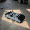 A transport trolley with multiple wheels is placed on a concrete floor in what appears to be a warehouse or workshop. Sunlight casts shadows across the floor. Podgląd zdjęcia produktu