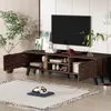 A modern TV stand with a dark wood grain finish is shown in a living room setting, with a TV on top and various decorative items and storage solutions. Produktbild-Vorschau