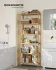 A tall, multi-tiered bamboo shelf unit filled with various bathroom items, positioned next to a bathtub and a vanity in a well-lit bathroom. Produktbild-Vorschau