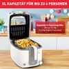 A white and gray deep fryer filled with french fries, placed on a wooden countertop with a kitchen background. Produktbild-Vorschau