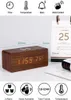 A wooden digital alarm clock with an LED display showing time and temperature, placed on a desk next to a calendar. Anteprima dell’immagine prodotto