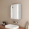 A modern bathroom sink and illuminated medicine cabinet. Podgląd zdjęcia produktu