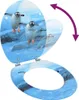 A toilet seat with a lid featuring a penguin design, shown open and attached to a toilet bowl. Náhled obrázku produktu