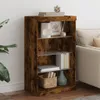 A wooden bookshelf with glass shelves filled with books and decorative items, placed next to a sofa. Produktbild-Vorschau