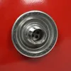A close-up, top-down view of a silver fitting with multiple holes, set against a bright red background. Produktbild-Vorschau