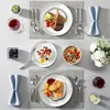 A table setting with multiple dishes and drinks. Náhled obrázku produktu
