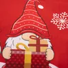 A close-up of a Christmas-themed fabric with gnomes and snowflakes. Náhled obrázku produktu