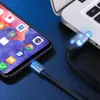 A smartphone is connected to a laptop via a USB-C cable. The cable has illuminated blue icons indicating data transfer or charging. Produktbild-Vorschau