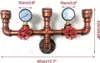 A wall-mounted light fixture made of pipes and gauges. Náhled obrázku produktu