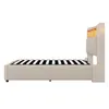 A side view of a beige upholstered bed frame with a slatted mattress support and a headboard with integrated lighting. Náhled obrázku produktu