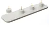A set of four LED tea lights on a white charging base, presented against a white background. Produktbild-Vorschau