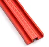 A close-up view of a red aluminum alloy parallel guide for a guide rail, showing a ruler marking. Náhled obrázku produktu