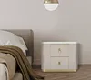 A bedroom scene with a nightstand next to a bed. Náhled obrázku produktu