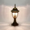 A classic outdoor lamp with a gold-bronze finish is shown against a light gray background with light patterns. Náhled obrázku produktu