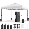 A white pop-up canopy tent is set up on a white surface, with its folded frame and accessories displayed nearby. Produktbild-Vorschau