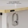 A close-up shot of a desk showing its underside with a pair of headphones hanging from a hook. Anteprima dell’immagine prodotto