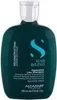 A dark teal shampoo bottle with a silver cap, set against a white background. Anteprima dell’immagine prodotto