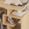 A close-up view of a wooden side table with books and decorative items. Produktbild-Vorschau