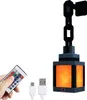 A hand holding a remote control next to a pixelated lantern light. Produktbild-Vorschau