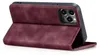 A burgundy flip case for an iPhone 13 Pro Max is shown from a side angle, standing upright. Produktbild-Vorschau