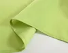 A close-up view of folded green fabric, likely a curtain or textile. Produktbild-Vorschau
