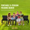 Four children are sitting and lying on a black portable folding bench in a grassy outdoor area. Náhľad obrázku produktu