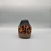 The back view of a single Adidas Samba OG shoe with a leopard print pattern. Produktbild-Vorschau