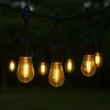 Outdoor string lights hanging in the dark. Voir les images du produit