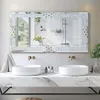 A luxurious bathroom vanity with two sinks and a large, ornate mirror. Produktbild-Vorschau