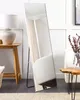 A full-length mirror is shown in a room setting, reflecting a chair and curtains. A lamp and a side table are also visible. Náhled obrázku produktu