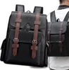 A man wearing a backpack, with another backpack in the foreground. Produktbild-Vorschau
