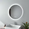 A round LED mirror with integrated lighting is mounted on a light gray wall above a white rectangular sink. Produktbild-Vorschau
