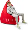 A young person is sitting on a large red beanbag chair. Náhled obrázku produktu