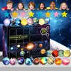 Children are peeking over a galaxy-themed advent calendar, with planet ornaments displayed in front. Náhled obrázku produktu