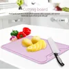 A cutting board with vegetables and a knife on a kitchen counter. Náhled obrázku produktu