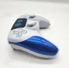 A white and blue wireless controller is shown on a white surface. Produktbild-Vorschau