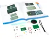 An open book with diagrams and electronic components laid out in front of it. Náhled obrázku produktu