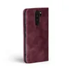 A burgundy flip case for a smartphone is shown from the side against a white background. Produktbild-Vorschau