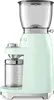 A pastel green Smeg coffee grinder is shown against a white background. Náhled obrázku produktu